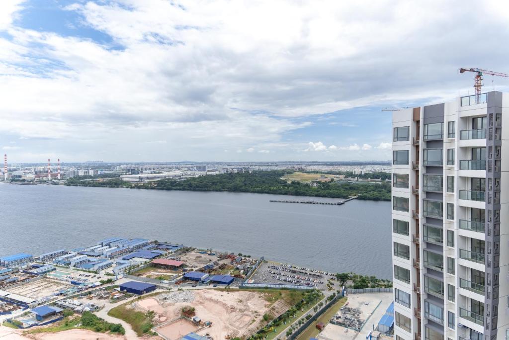 an aerial view of a building next to a body of water at R&F Princess Cove @ R&F Mall in Johor Bahru
