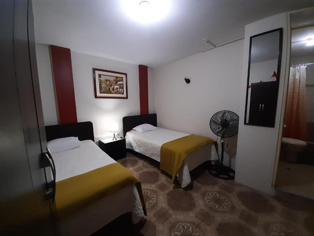 Postel nebo postele na pokoji v ubytování Apartments & Rooms Helena