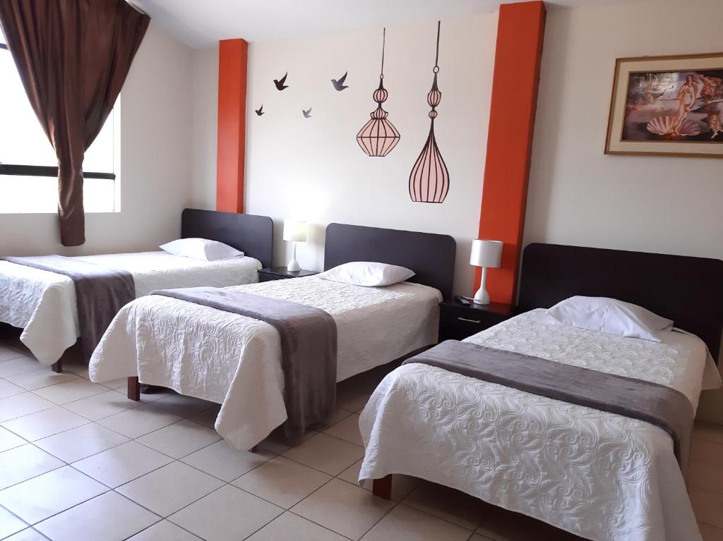 Postel nebo postele na pokoji v ubytování Apartments & Rooms Helena