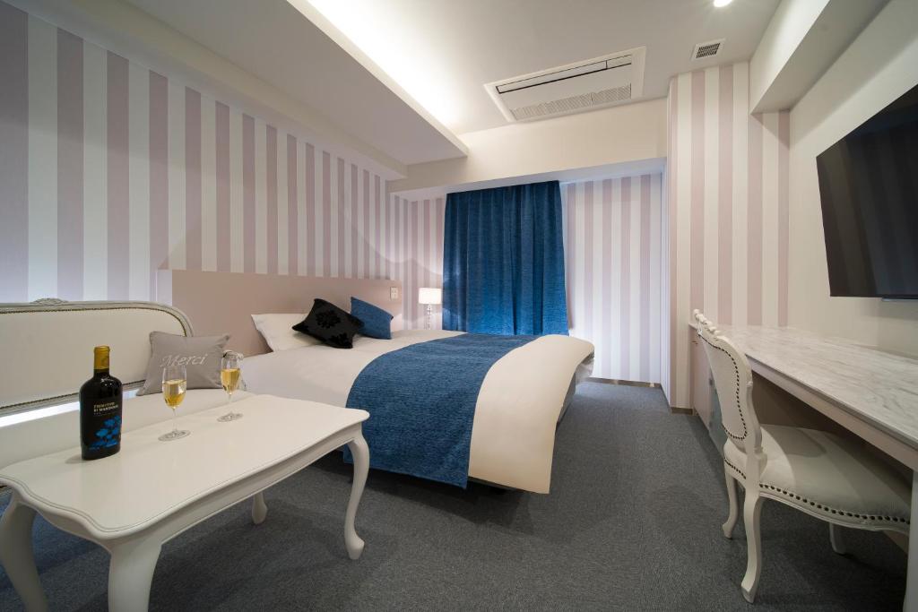 Postel nebo postele na pokoji v ubytování HOTEL LASCALA