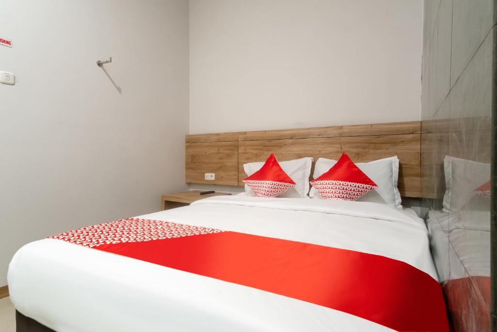 Postel nebo postele na pokoji v ubytování OYO 3159 Festive Inn