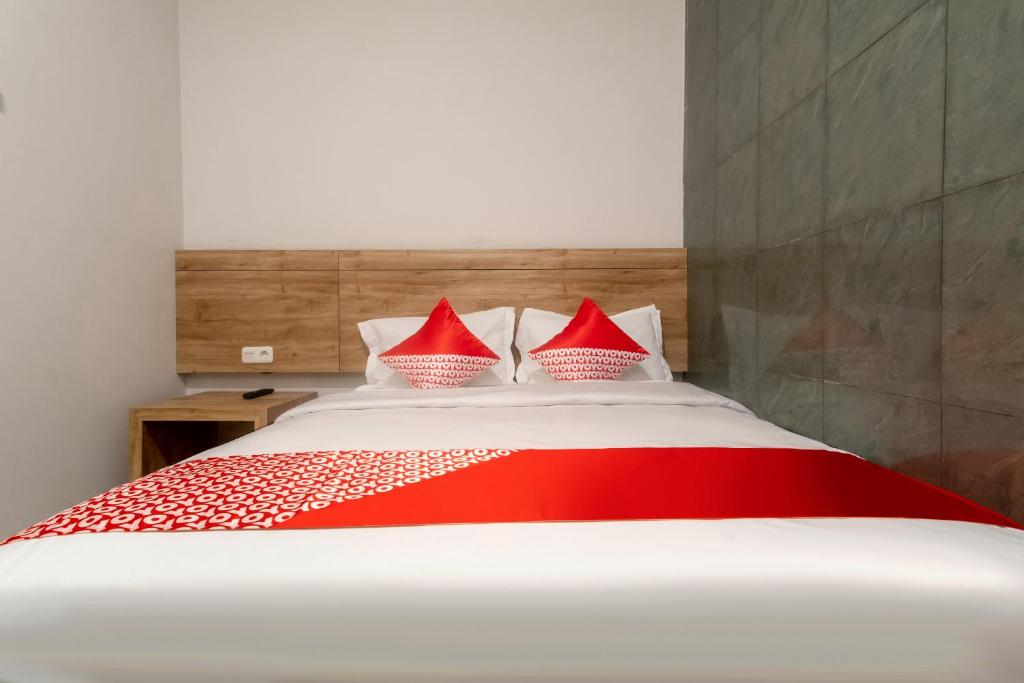 Postel nebo postele na pokoji v ubytování OYO 3159 Festive Inn