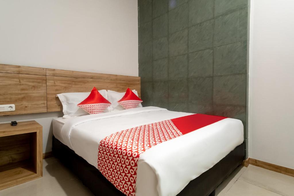 Postel nebo postele na pokoji v ubytování OYO 3159 Festive Inn