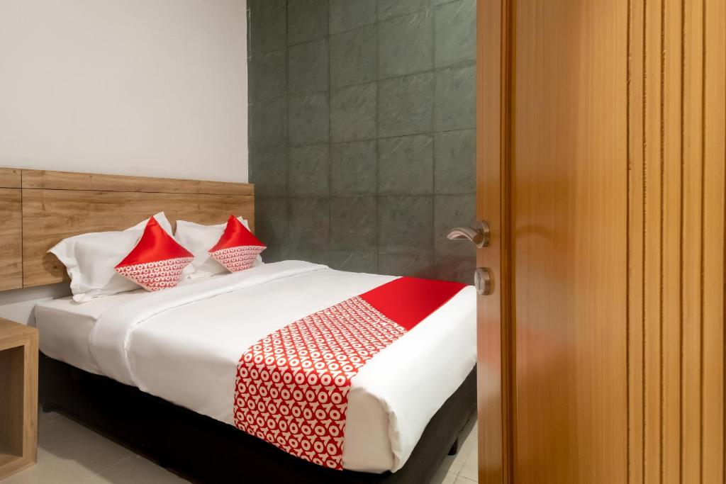 Postel nebo postele na pokoji v ubytování OYO 3159 Festive Inn