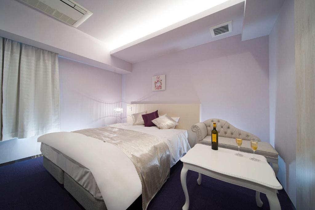 Postel nebo postele na pokoji v ubytování HOTEL LASCALA