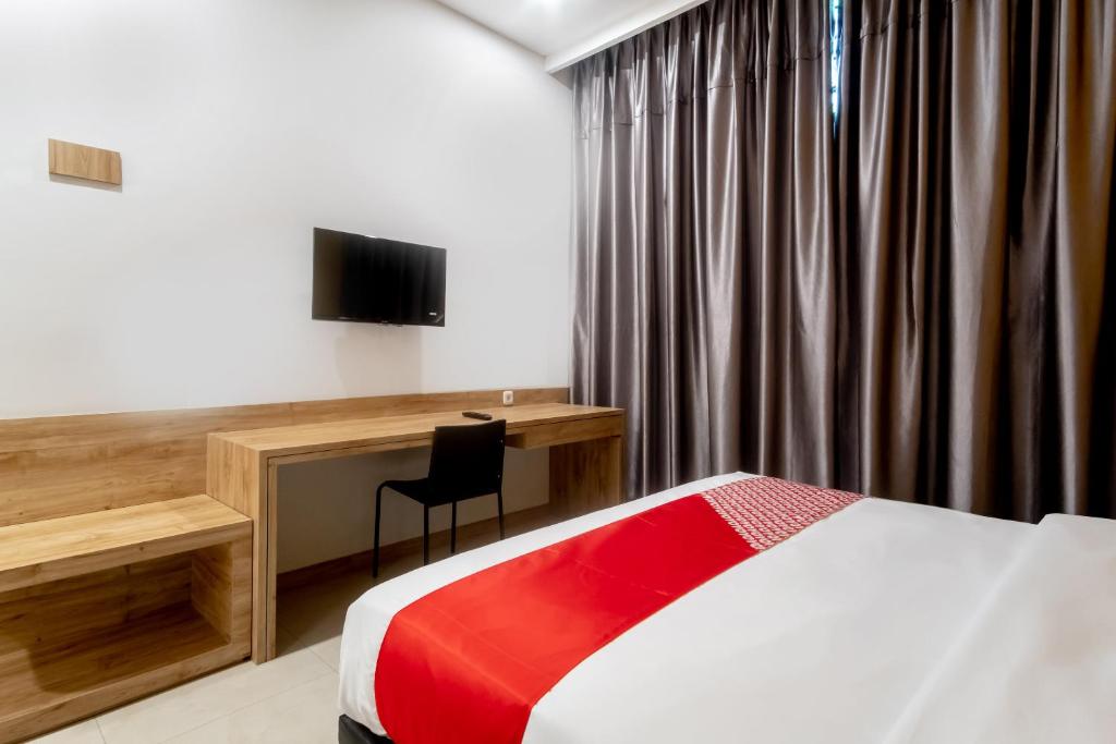 TV a/nebo společenská místnost v ubytování OYO 3159 Festive Inn