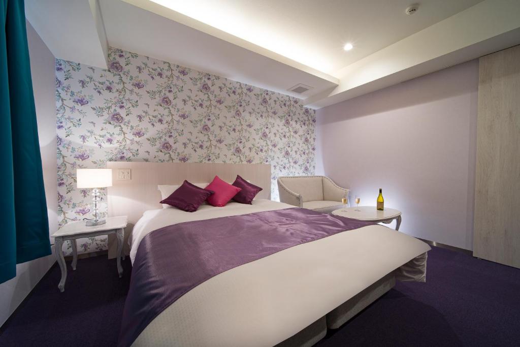 Postel nebo postele na pokoji v ubytování HOTEL LASCALA