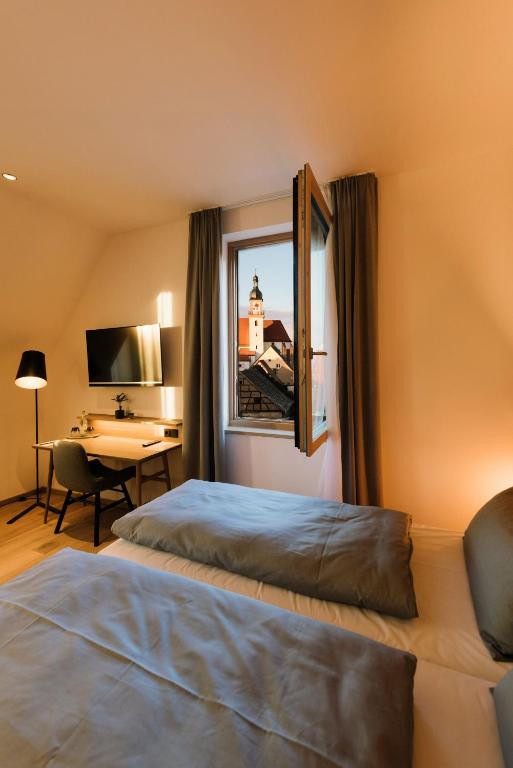 Postel nebo postele na pokoji v ubytování Hotel Johanns