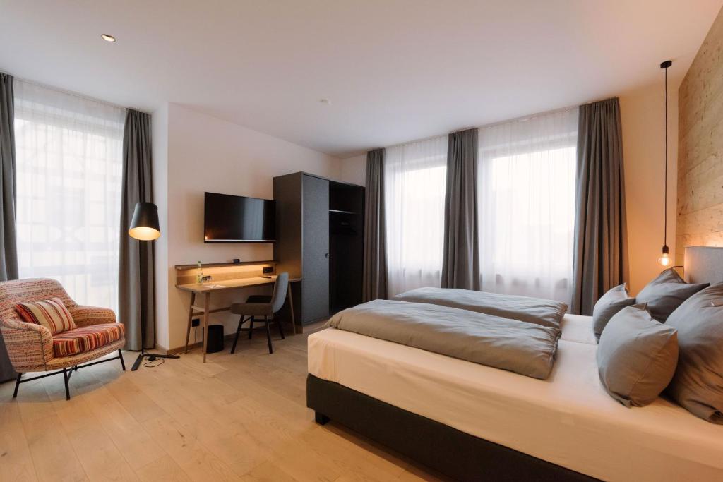 Postel nebo postele na pokoji v ubytování Hotel Johanns