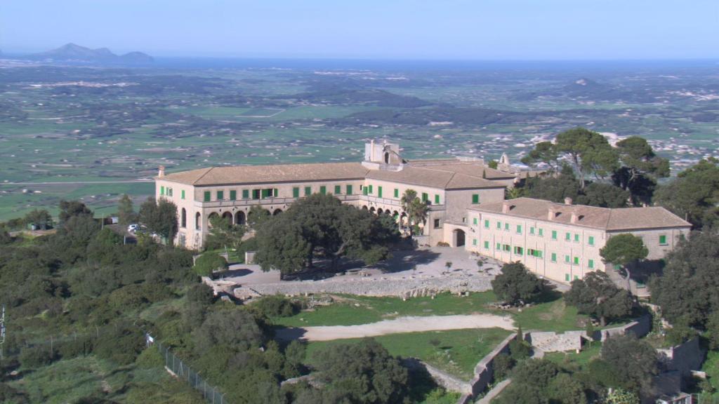 an aerial view of a large house on a hill at Santuari de Cura in Randa