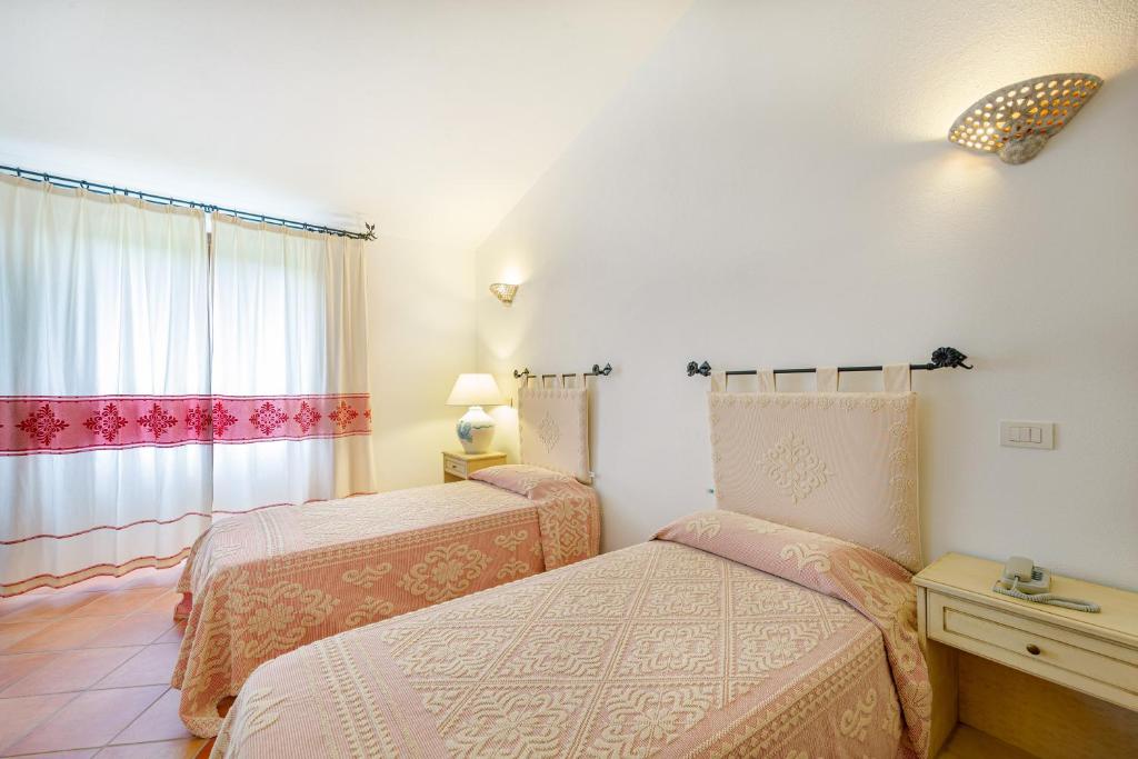 Postel nebo postele na pokoji v ubytování Hotel San Trano