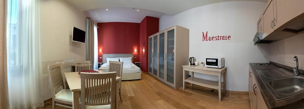 Televízia a/alebo spoločenská miestnosť v ubytovaní Residenza Palazzo Negri