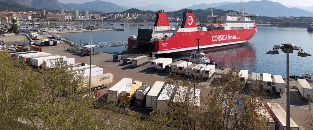 a large red boat is docked in a harbor at Hotel le Dauphin in Ajaccio