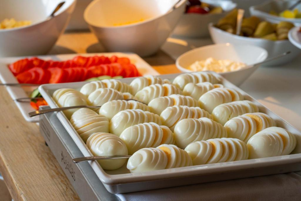 a tray of marshmallows on a table with other food at Hotel Hallormsstadur in Hallormsstaður