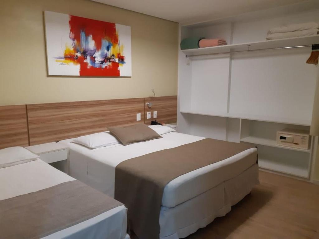 Postel nebo postele na pokoji v ubytování Hotel Três Caravelas
