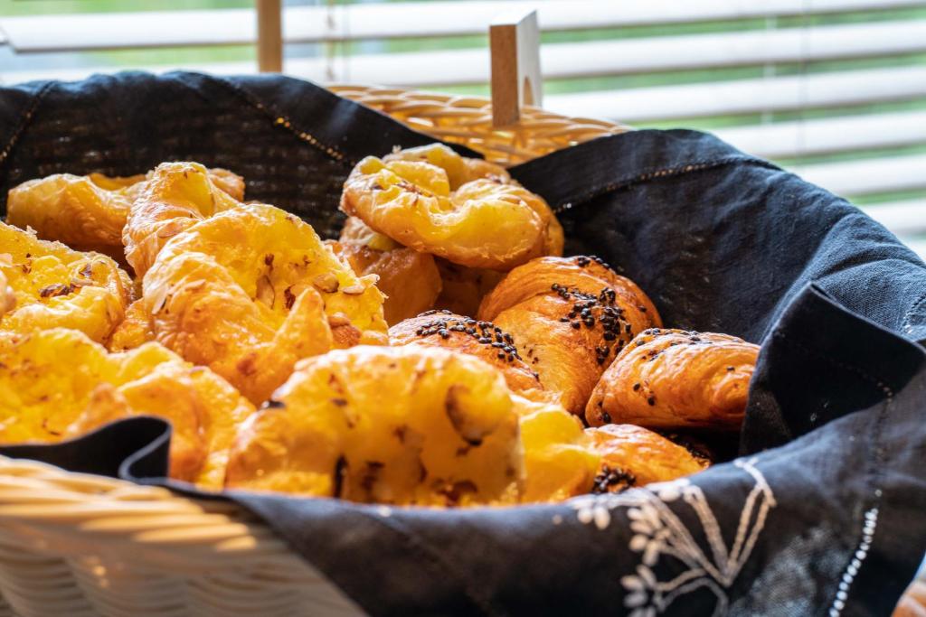 a basket full of pastries on a table at Hotel Hallormsstadur in Hallormsstaður
