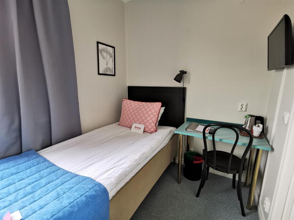 Postel nebo postele na pokoji v ubytování 2Home Hotel Gävle