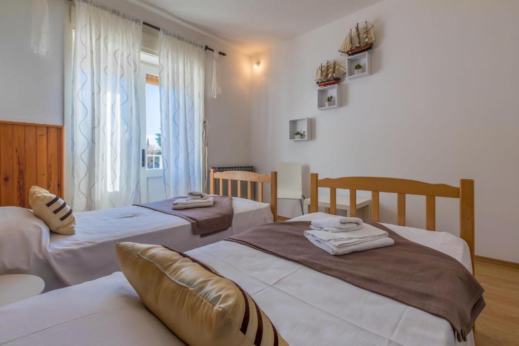 Postel nebo postele na pokoji v ubytování Apartment Roni