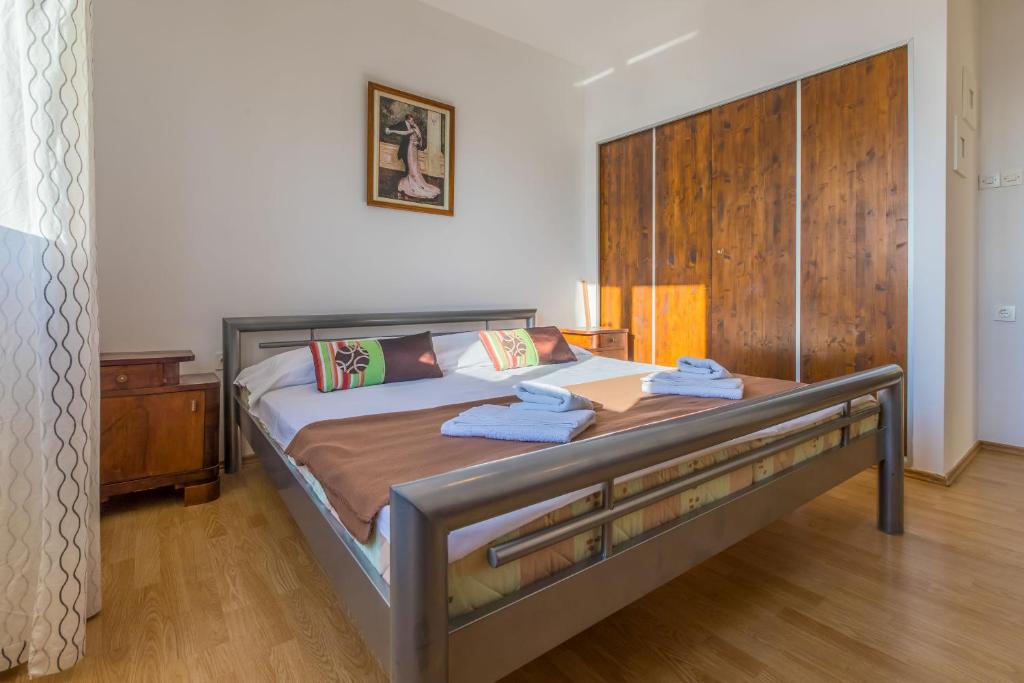 Postel nebo postele na pokoji v ubytování Apartment Roni