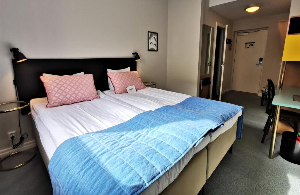 Postel nebo postele na pokoji v ubytování 2Home Hotel Gävle