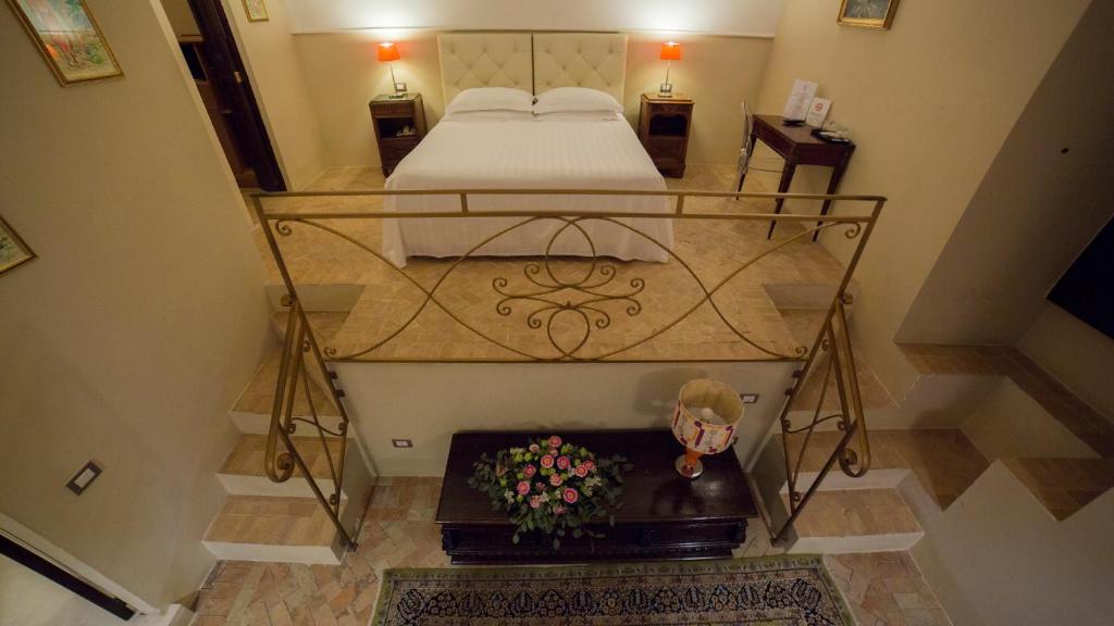 Posteľ alebo postele v izbe v ubytovaní Palazzo Viceconte