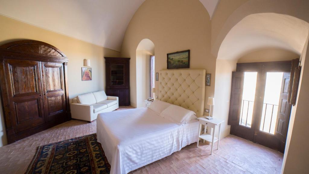 Posteľ alebo postele v izbe v ubytovaní Palazzo Viceconte