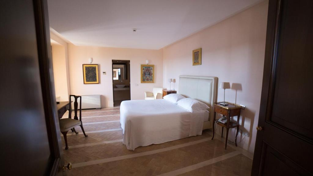 Posteľ alebo postele v izbe v ubytovaní Palazzo Viceconte