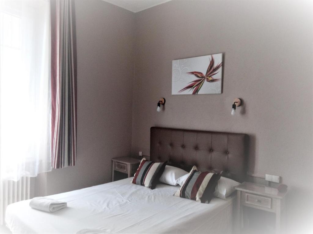 Postel nebo postele na pokoji v ubytování Hotel Astoria