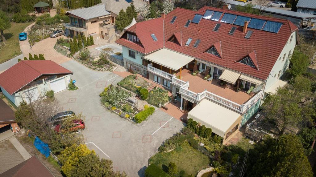 an overhead view of a large house with a flooded yard at Le Rose Hotel in Budapest