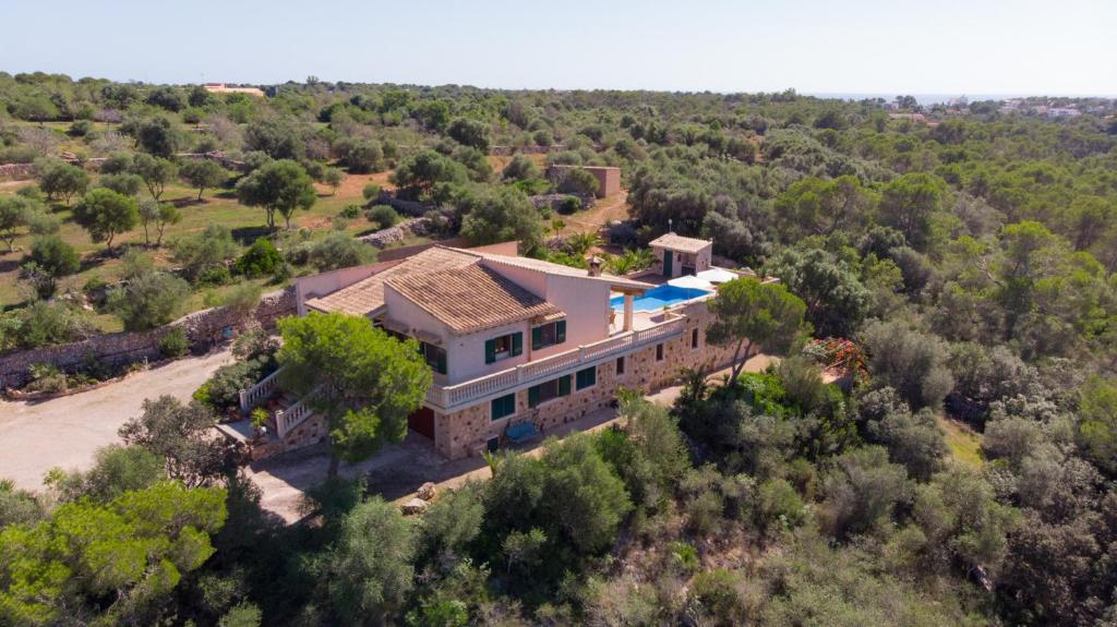 an aerial view of a house in the forest at Finca Melanie • Cala Santanyí in Santanyi