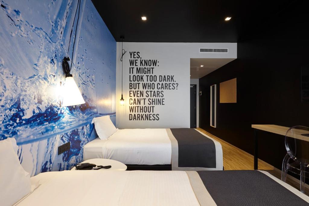 Postel nebo postele na pokoji v ubytování Hotel Aqua