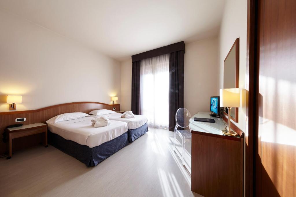 Postel nebo postele na pokoji v ubytování Hotel Aqua