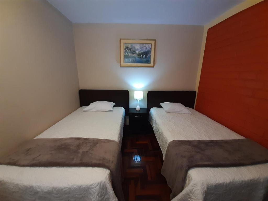 Postel nebo postele na pokoji v ubytování Apartments & Rooms Helena