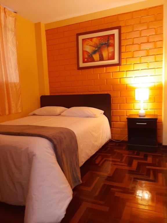 Postel nebo postele na pokoji v ubytování Apartments & Rooms Helena