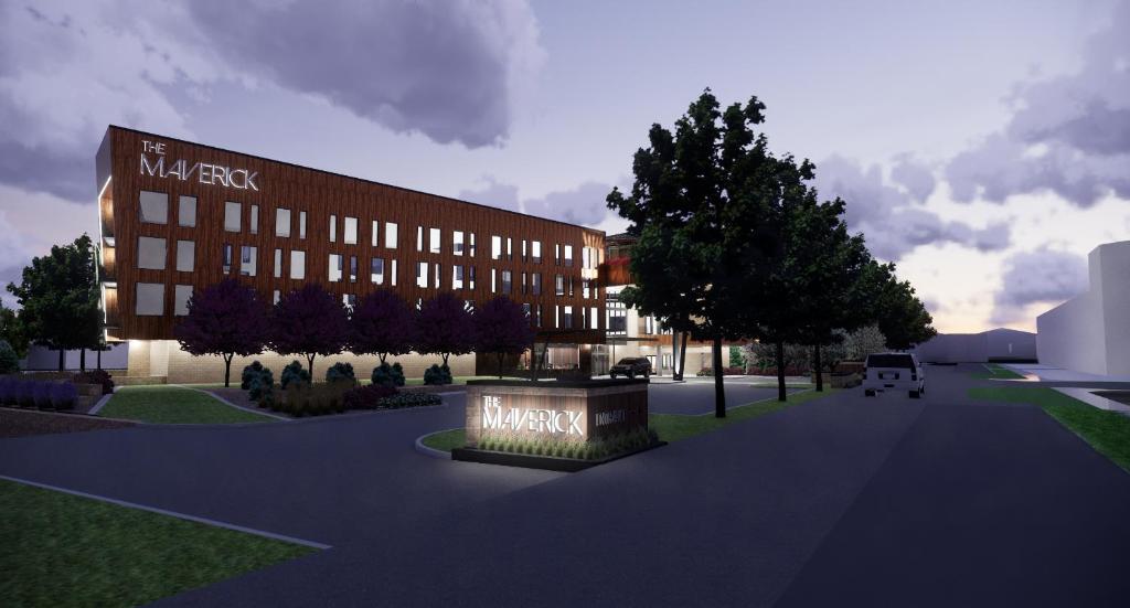 a rendering of a building with a sign in front of it at Hotel Maverick in Grand Junction