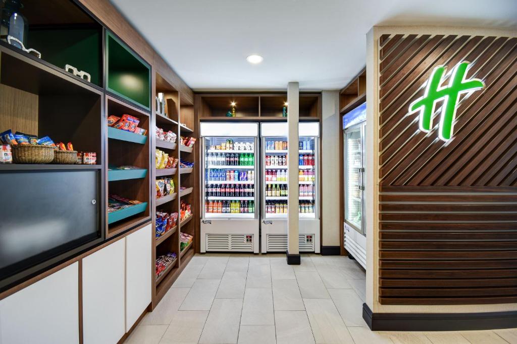 a grocery store aisle with a store sign on the wall at Holiday Inn Allentown-Bethlehem by IHG in Allentown