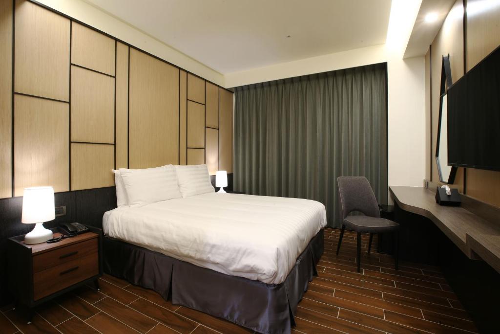 Hotel A 聖禾大飯店房間的床