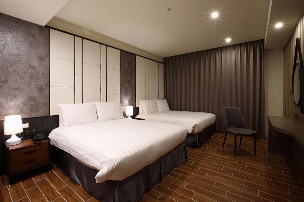 Hotel A 聖禾大飯店房間的床