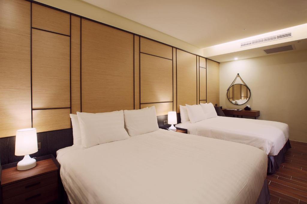 Hotel A 聖禾大飯店房間的床