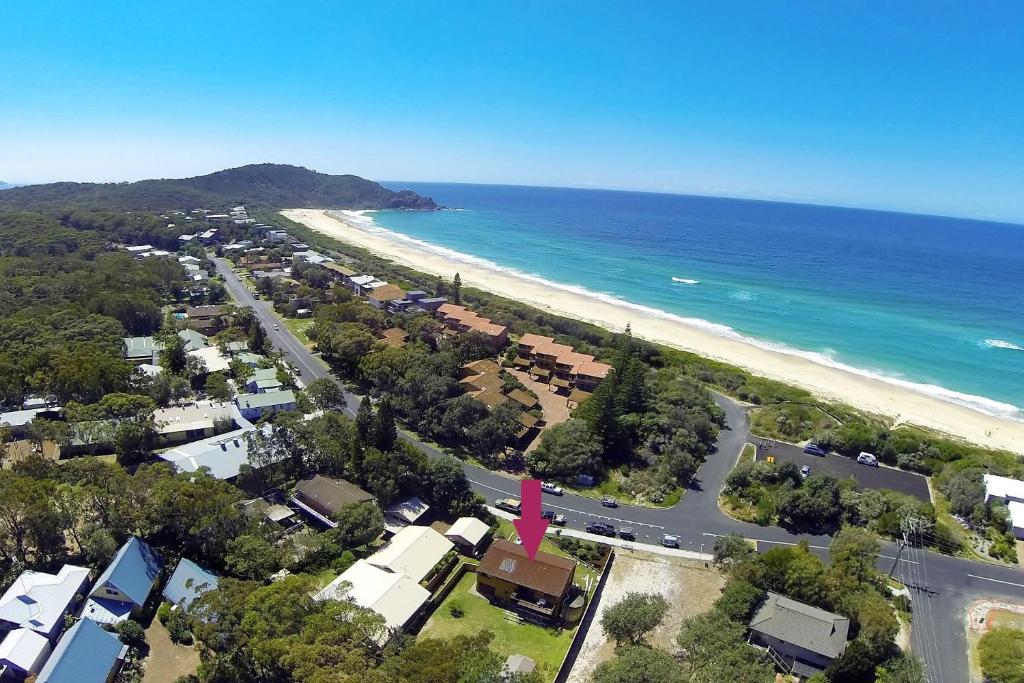 an aerial view of a beach and the ocean at BARRELS AT BOOMERANG in Blueys Beach