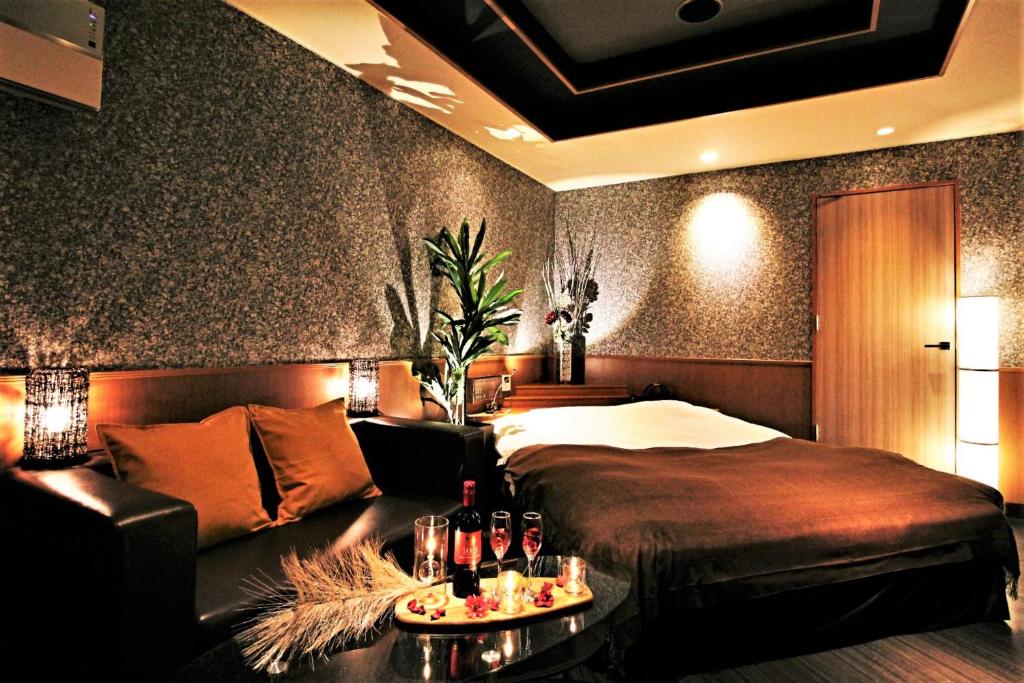 Postel nebo postele na pokoji v ubytování HOTEL O2 -Adult Only-