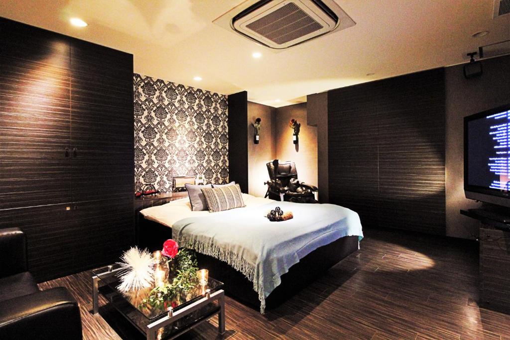 Postel nebo postele na pokoji v ubytování HOTEL O2 -Adult Only-