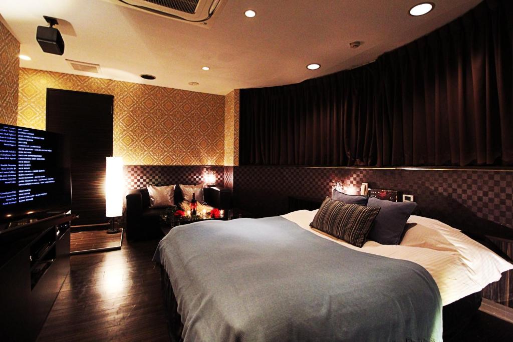 Postel nebo postele na pokoji v ubytování HOTEL O2 -Adult Only-