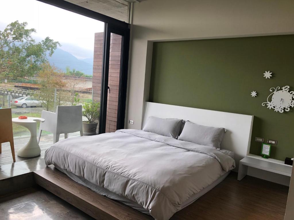 Postel nebo postele na pokoji v ubytování One Piece B&B