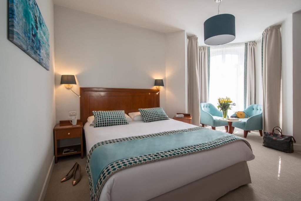 Postel nebo postele na pokoji v ubytování Hotel Olympia