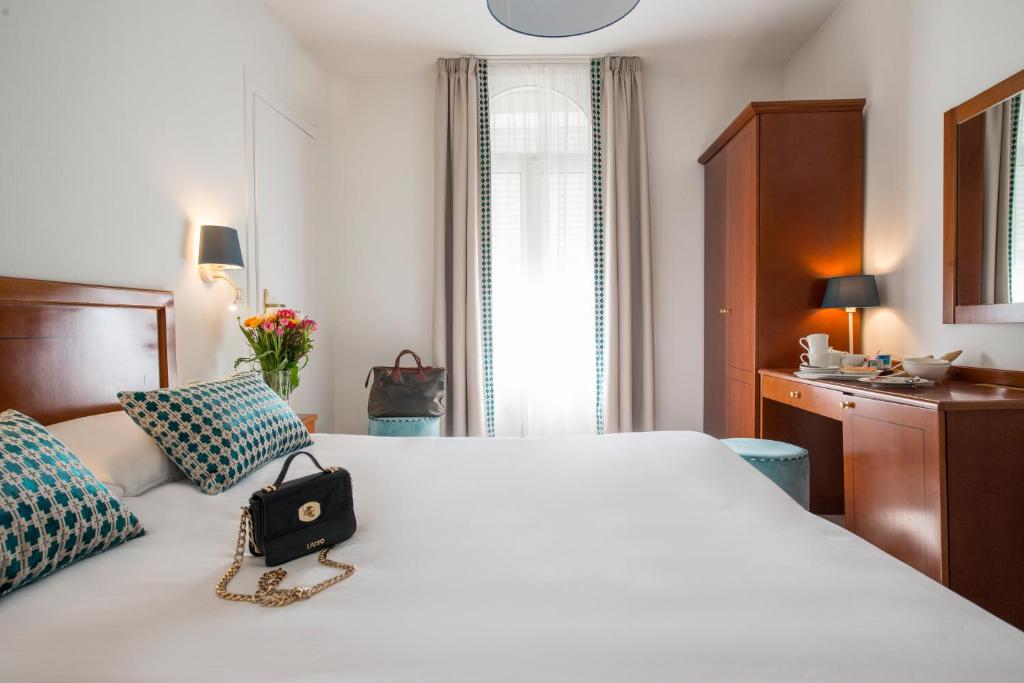 Postel nebo postele na pokoji v ubytování Hotel Olympia