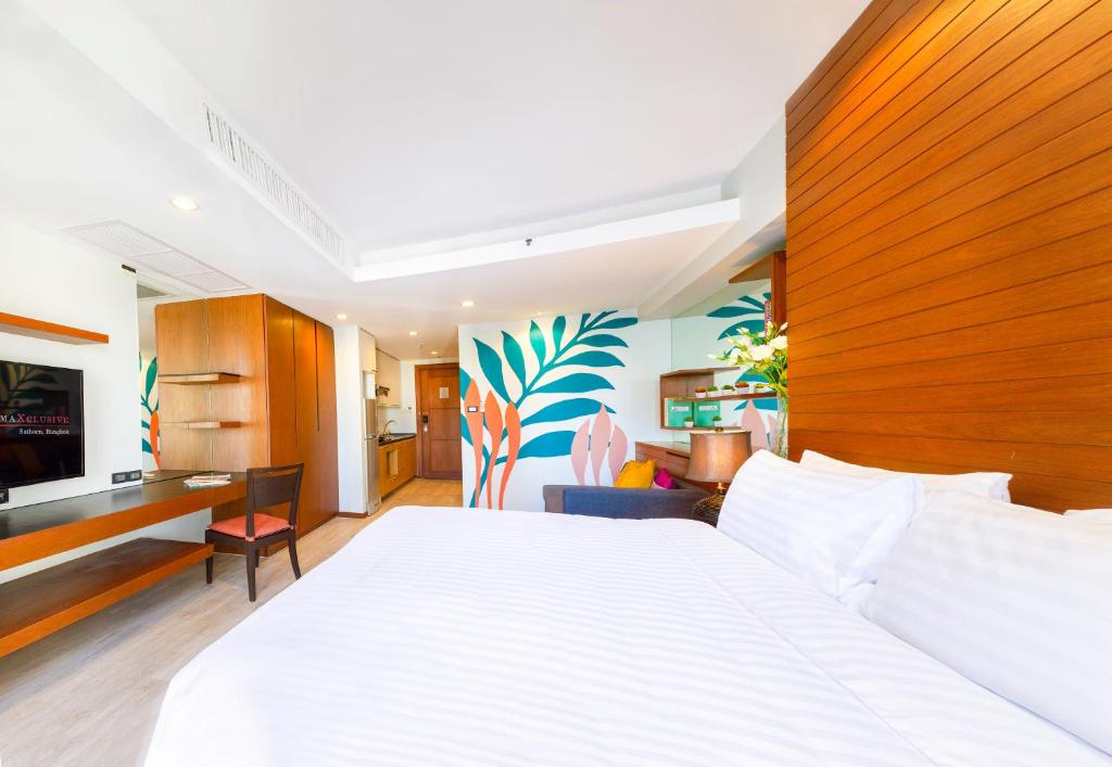 Postel nebo postele na pokoji v ubytování FuramaXclusive Sathorn, Bangkok