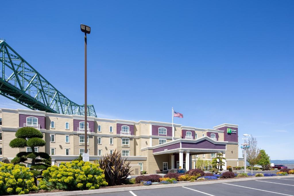 a rendering of a hotel with a bridge in the background at Holiday Inn Express Hotel & Suites Astoria, an IHG Hotel in Astoria, Oregon