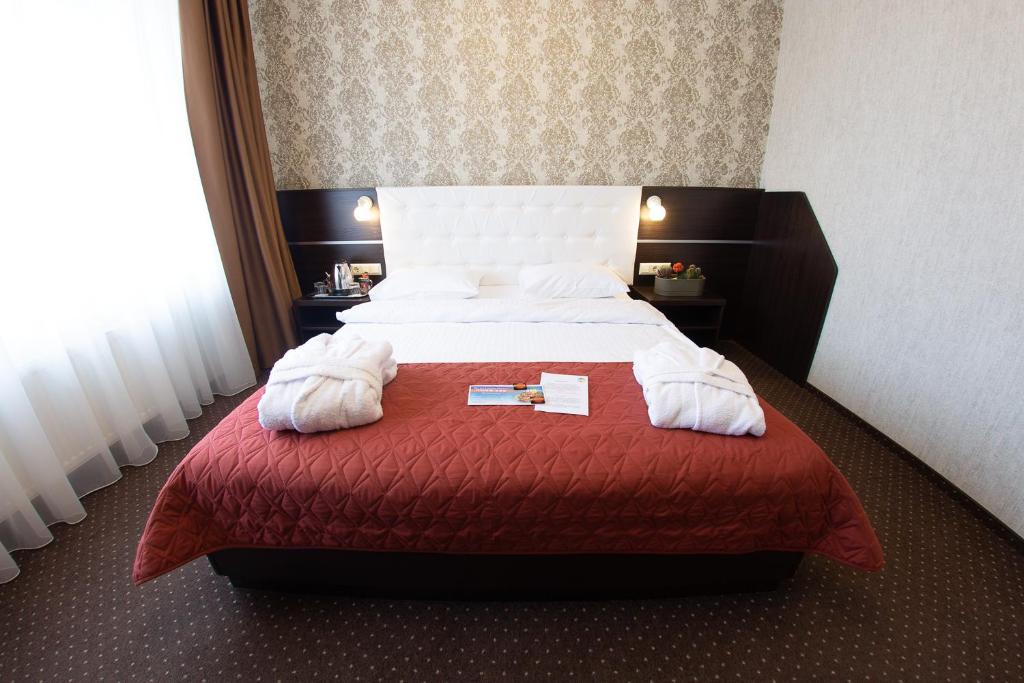 Postel nebo postele na pokoji v ubytování Kiev 365 Park Hotel