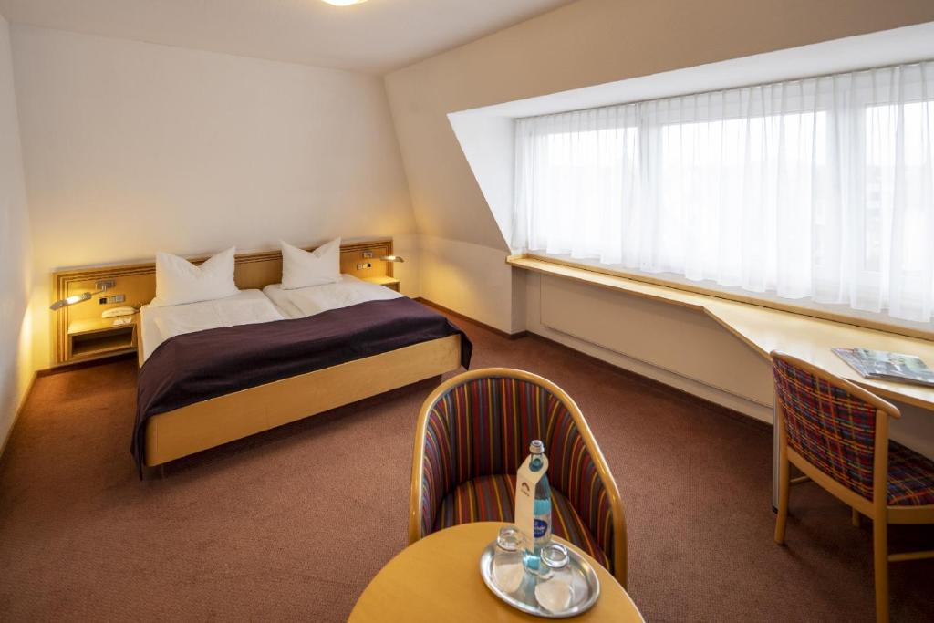 Postel nebo postele na pokoji v ubytování Hotel Gloria Superior